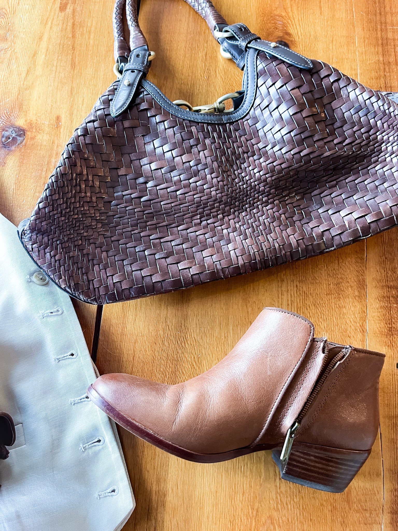 tan vest, brown basket weave leather purse, brown leather booties