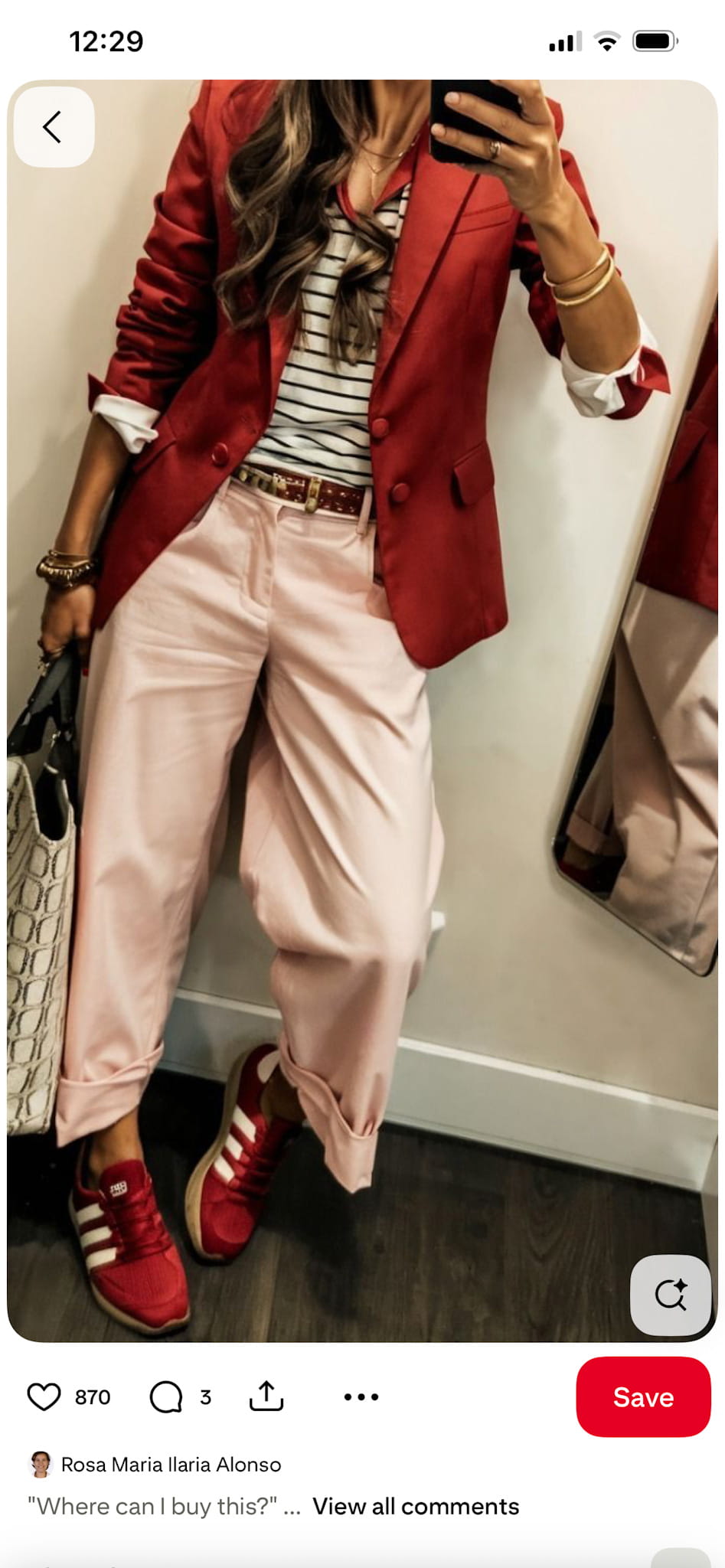 woman in a red blazer, black and white striped shirt, pink pants, and red shoes