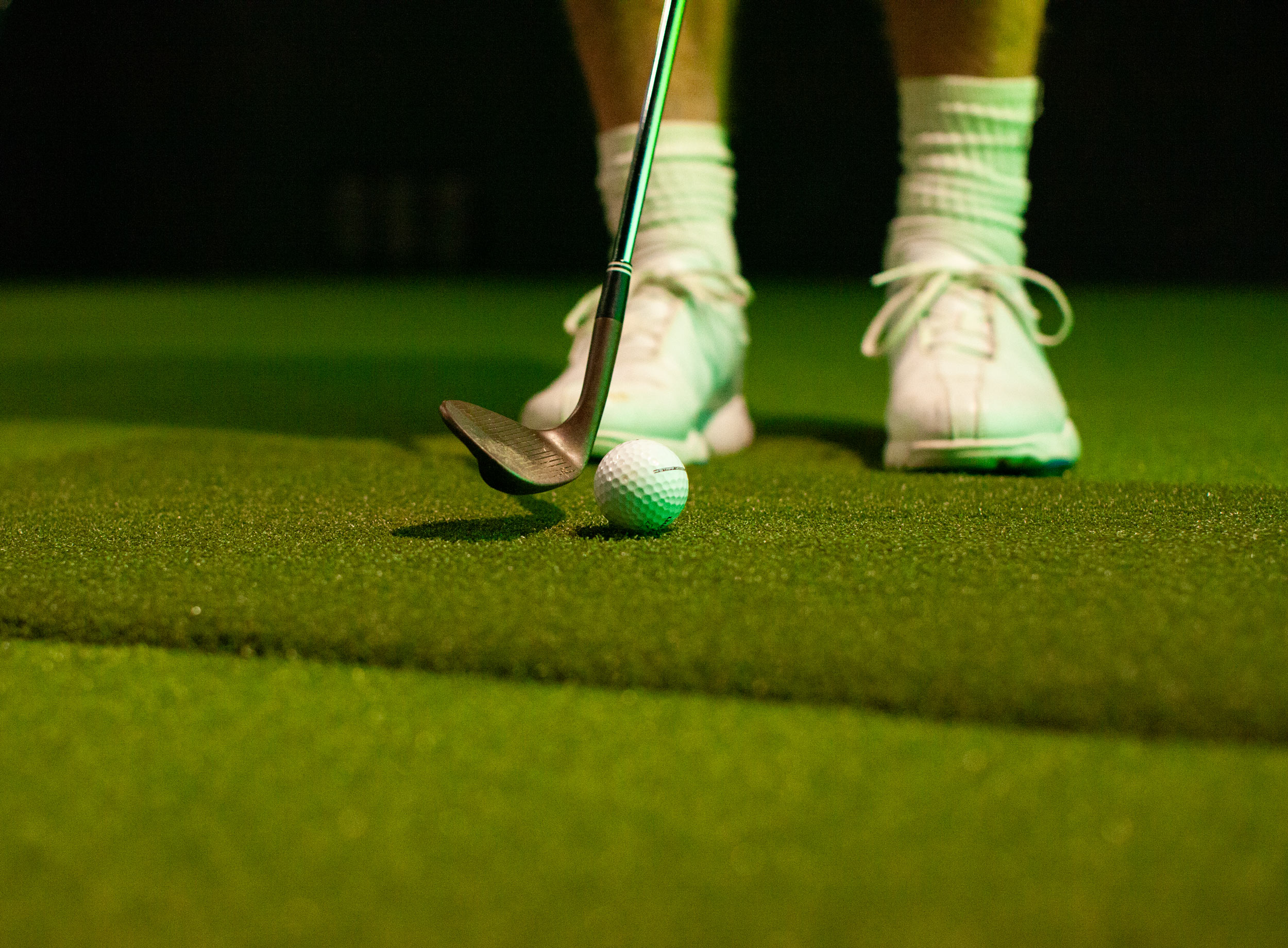 Golf balls on the practice ball pad at Smash Factor Wollongong