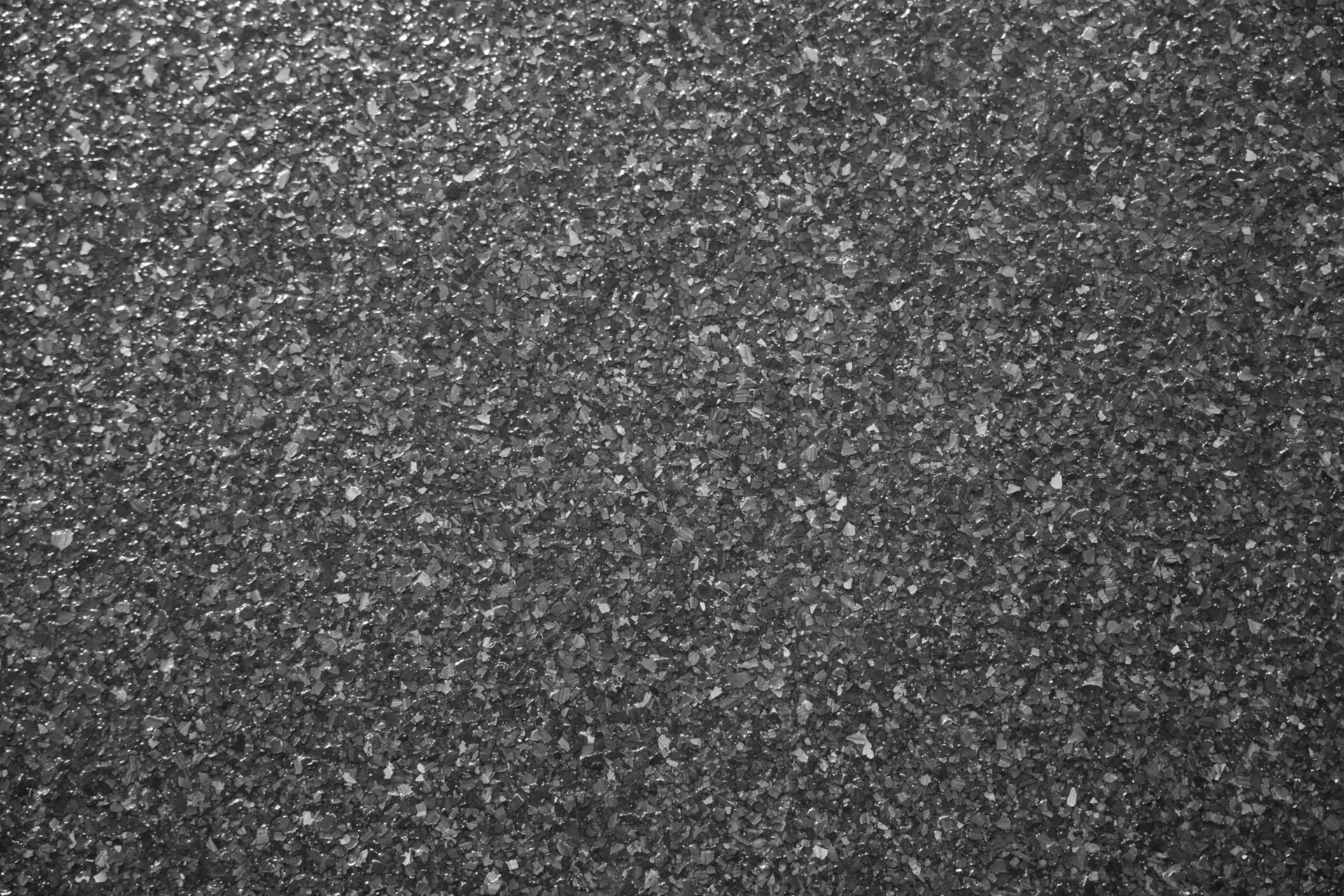 Detailed close-up of decorative flake texture in a polyaspartic floor coating system.