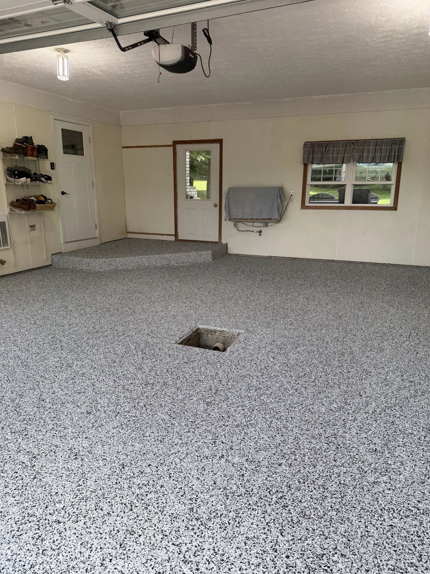 Finished Domino flake floor coating in a residential Sugarcreek garage