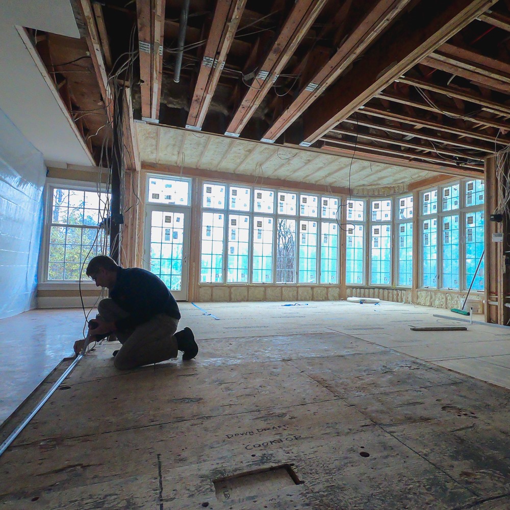 a man working on the bedroom renovation
