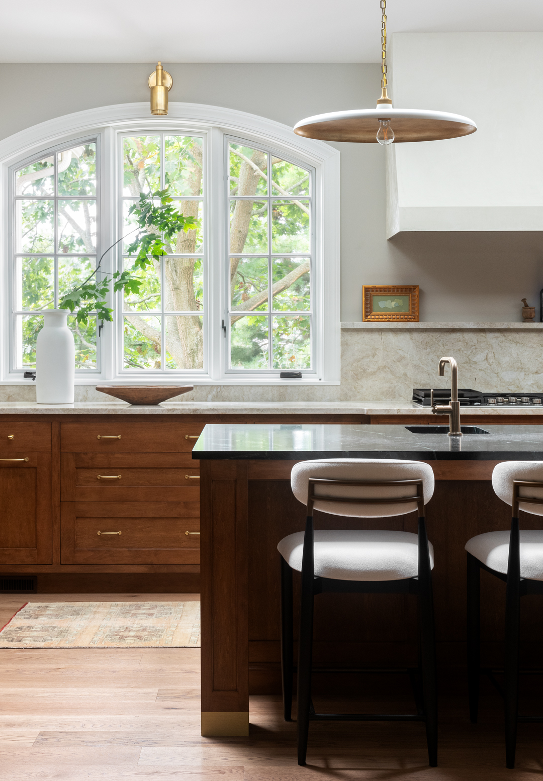 Charming Caucasian woman having positive breakfast in modern kitchen