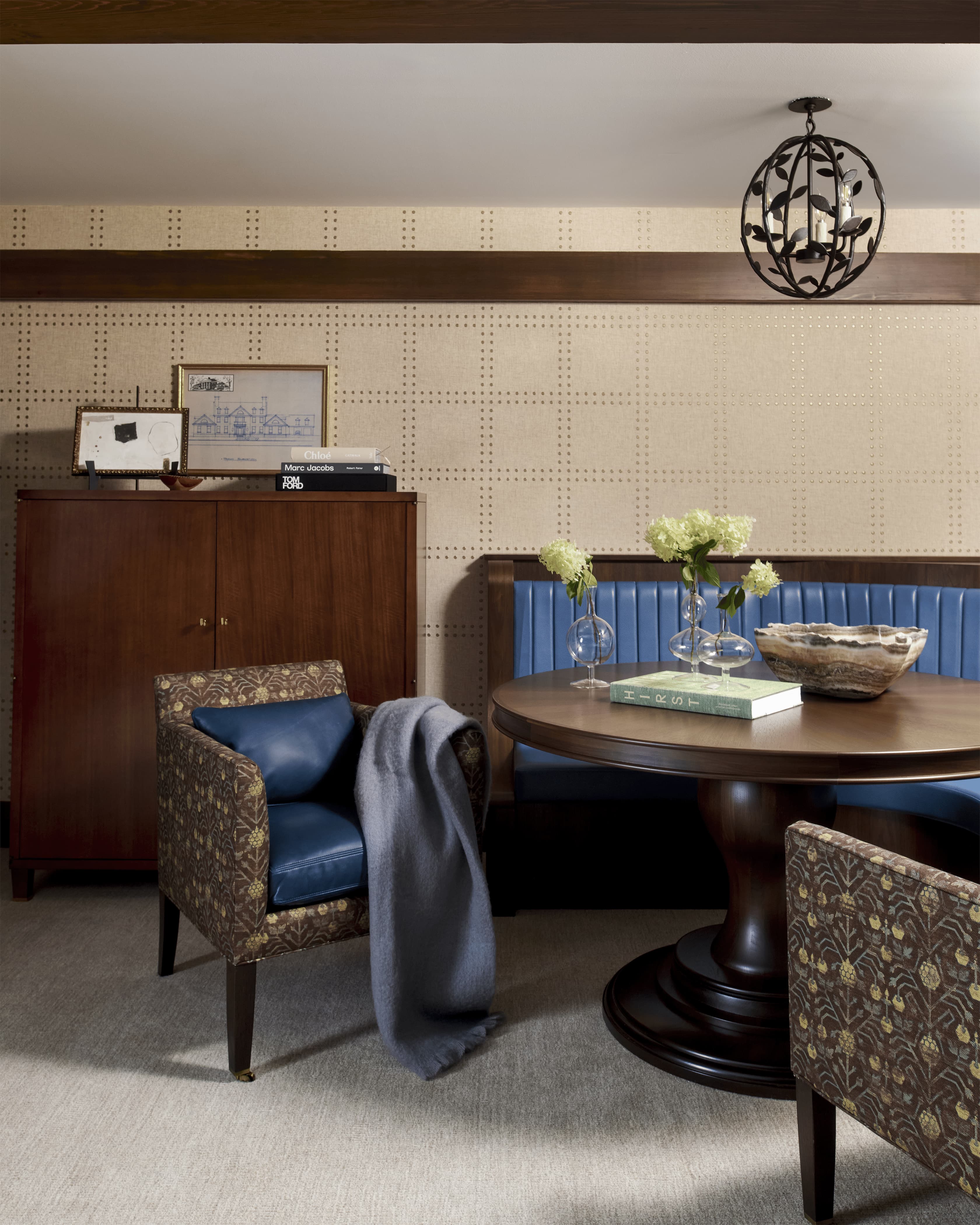 Luxury leather chair by a round table.