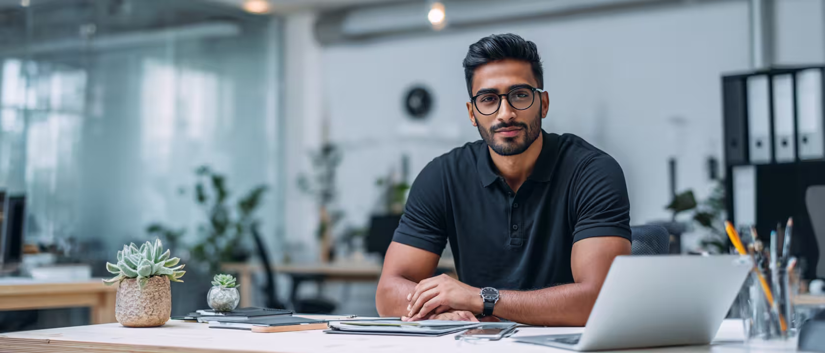 Representing what is executive coaching, a man sitting confidently at his table with confidence.
