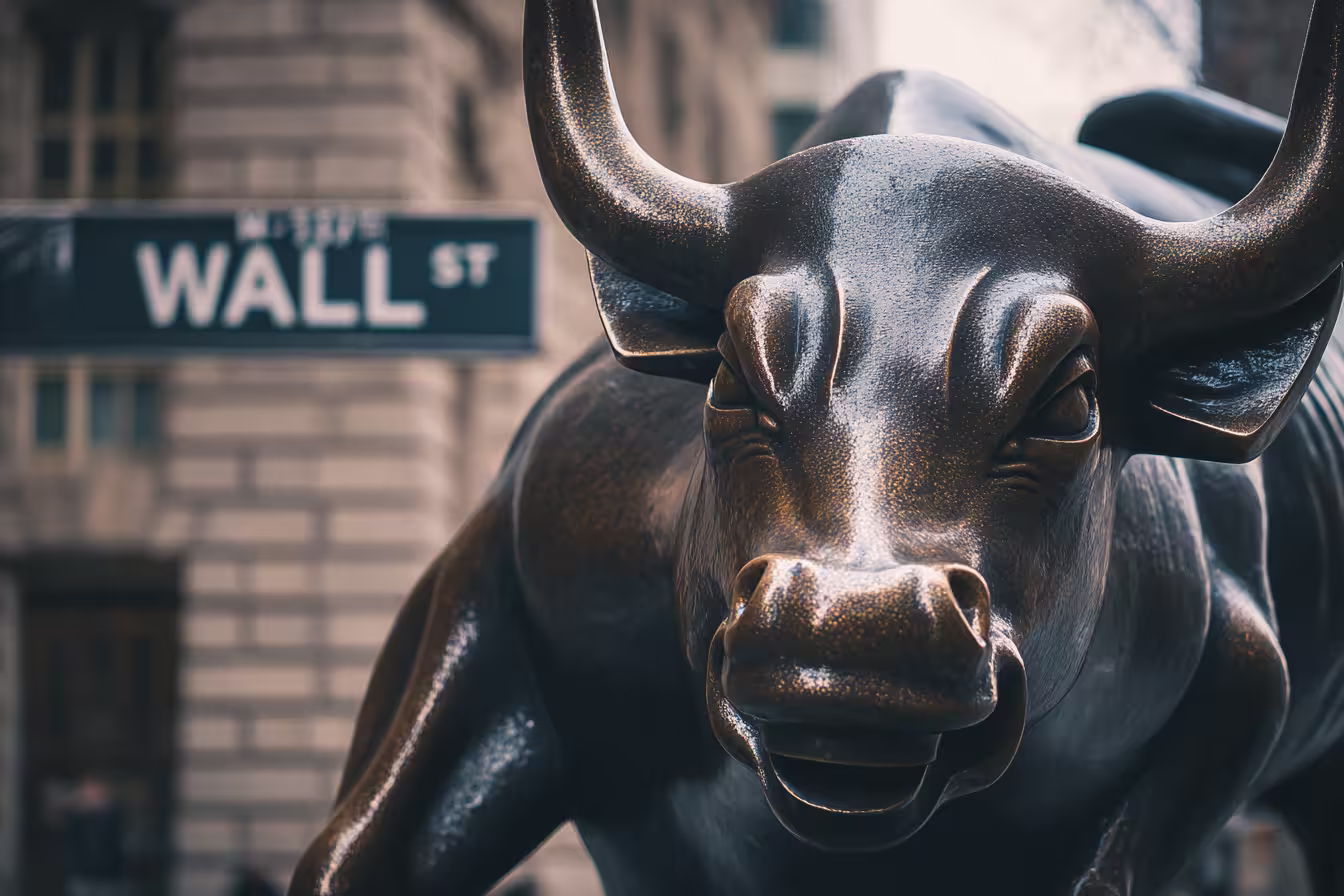 Photo representing executive coach fees & leadership ROI as Wall Street bull statue symbolizing financial growth