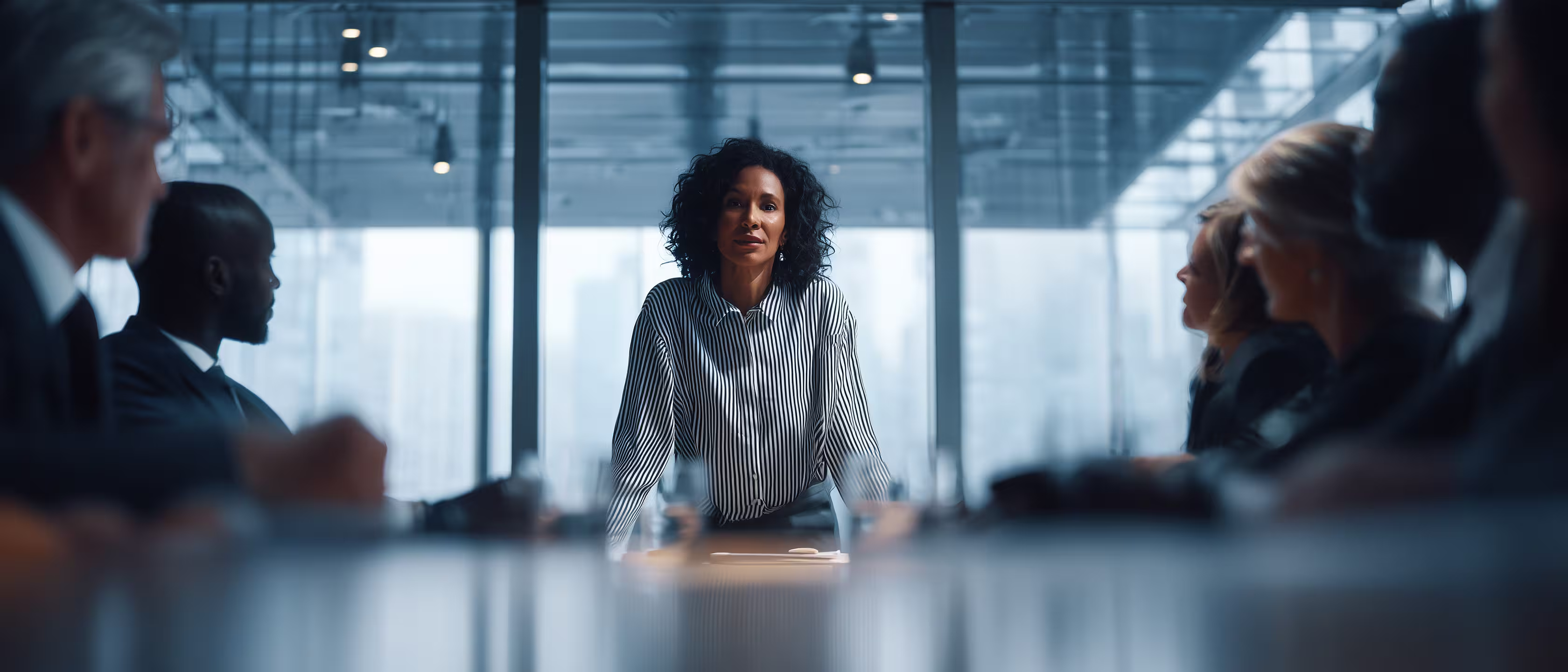 High performing leaders in a modern boardroom, collaborating on strategy and driving organizational excellence.