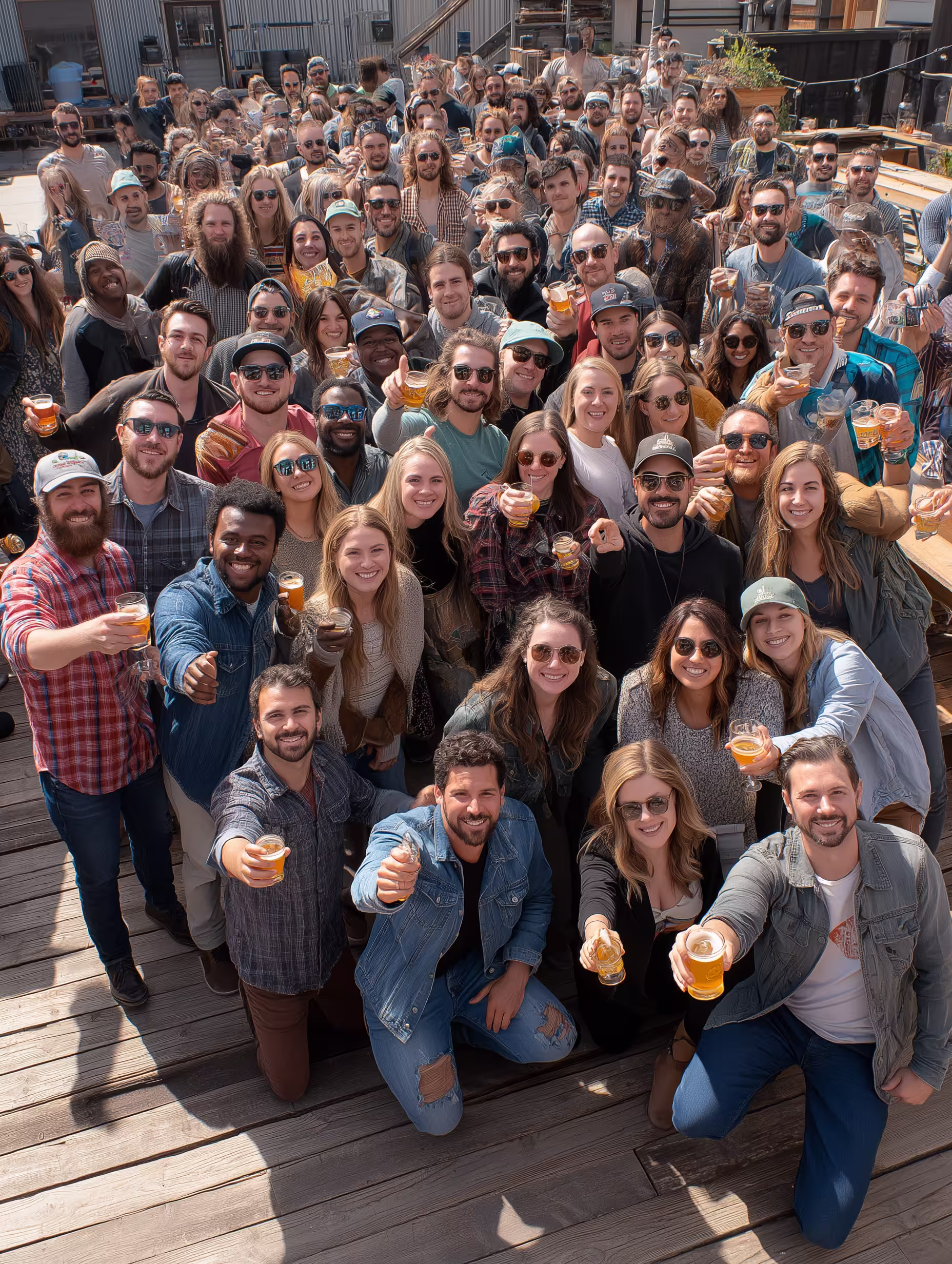 Executive Coaching ROI is about the ripple impact of company culture, represented by a group of people together happy.