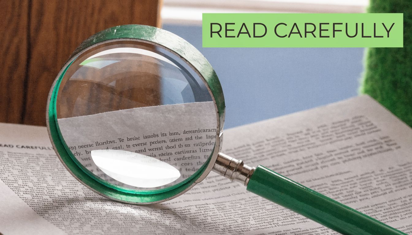 A magnifying glass resting on a document with the bold text READ CAREFULLY visible above.