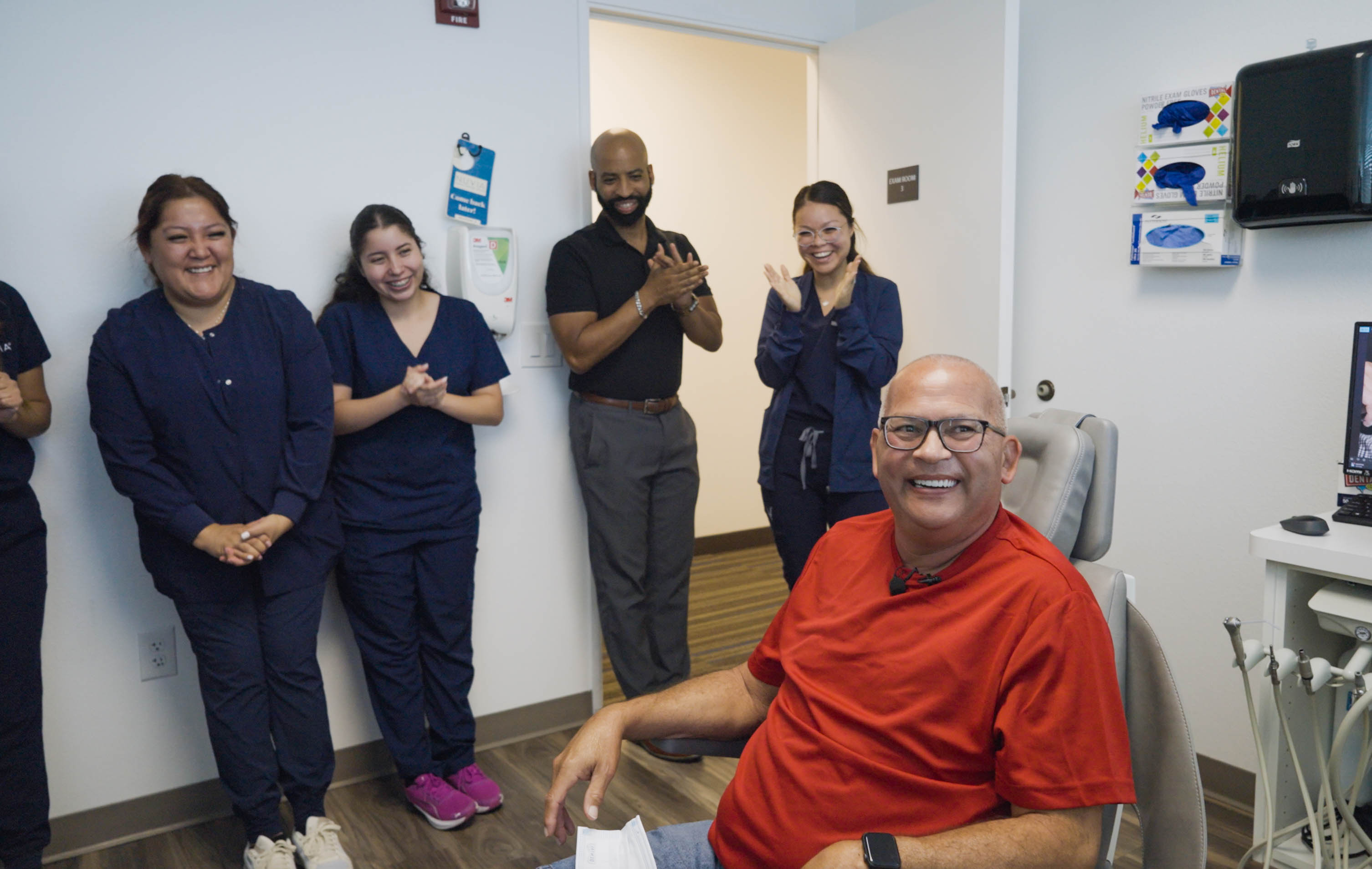 Man smiling after his dental implant surgery
