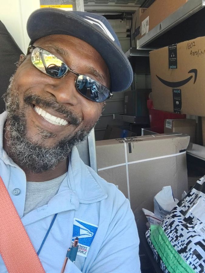 Smiling man with dental implants back at work