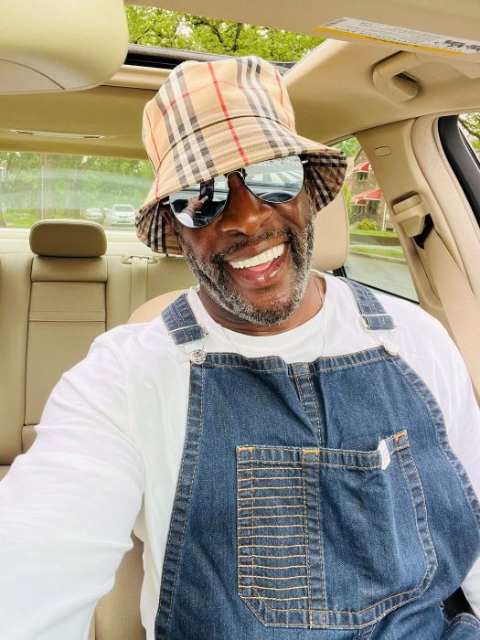 Alvin smiling with his dental implants and new set of teeth