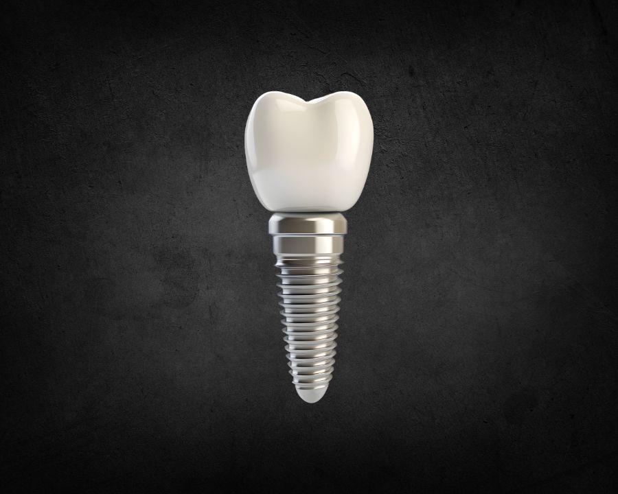 Image of single tooth implant against dark ba