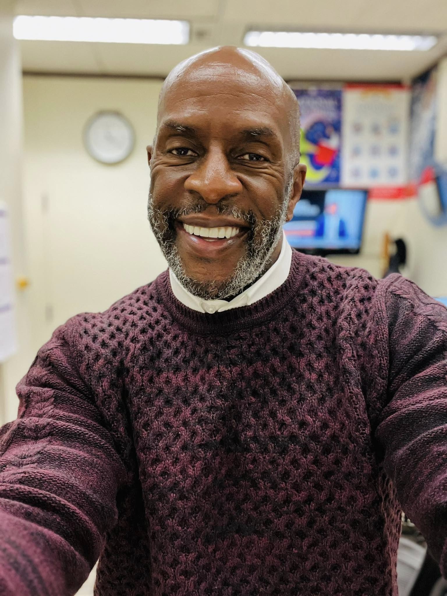 Alvin confidently smiling with his new teeth