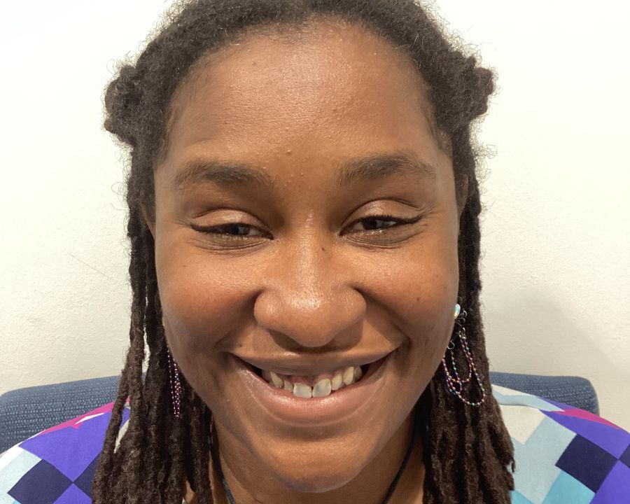 Angel smiling before getting her new smile