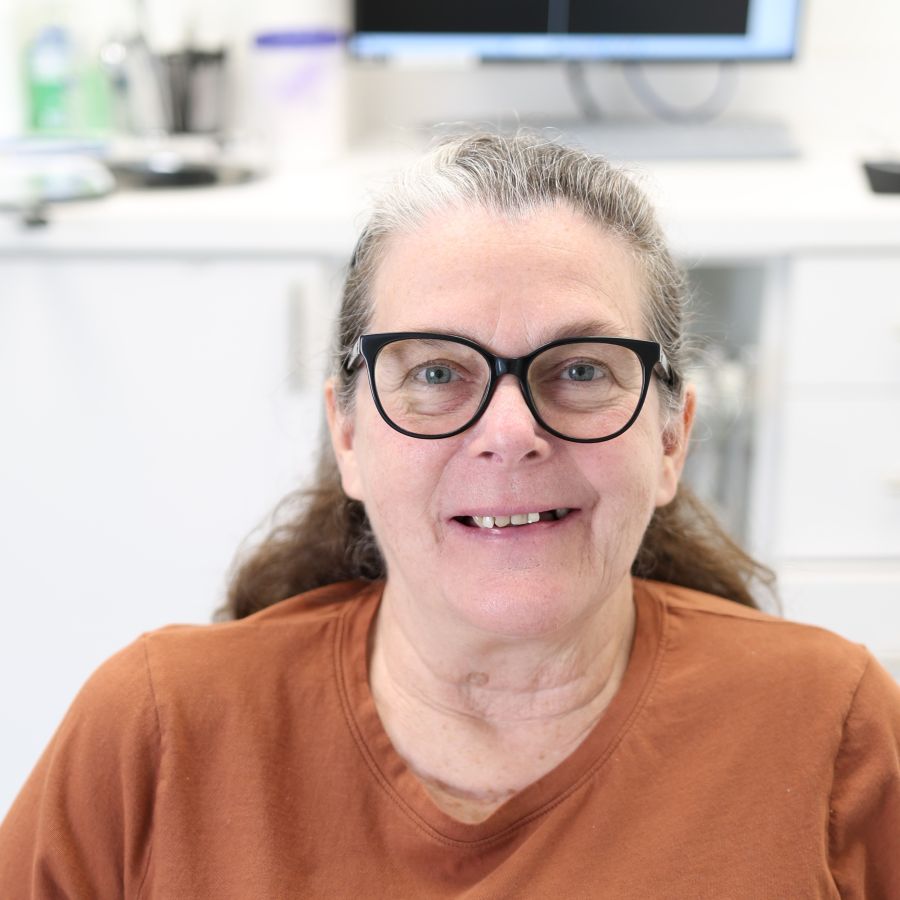 Terri smiling before the dental implant recovery journey
