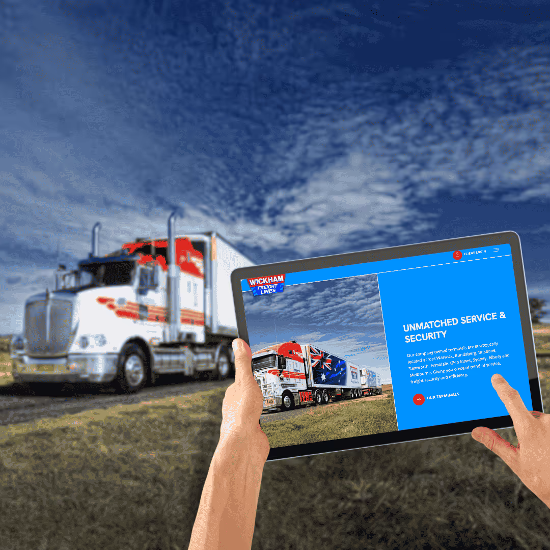 Person using tablet to view truck information in front of semi-trailer