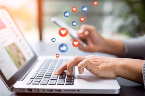 social media likes on laptop