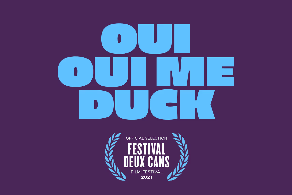 Graphic with the words 'OUI OUI ME DUCK' in large blue letters on a purple background, with the Festival Deux Cans official selection laurel for 2021 below.