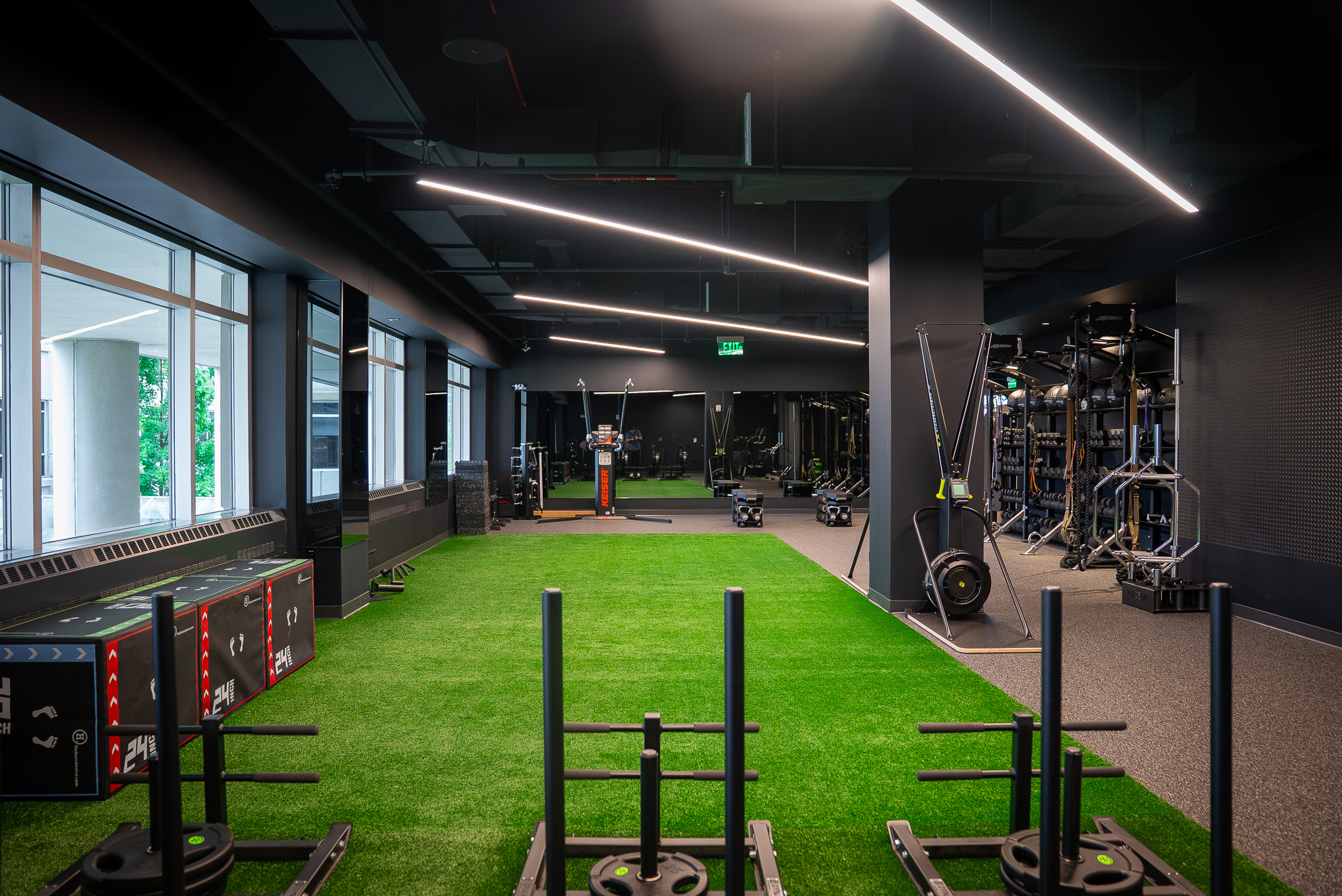 Dedicated functional training area with turf flooring at FIELDHOUSE gym.