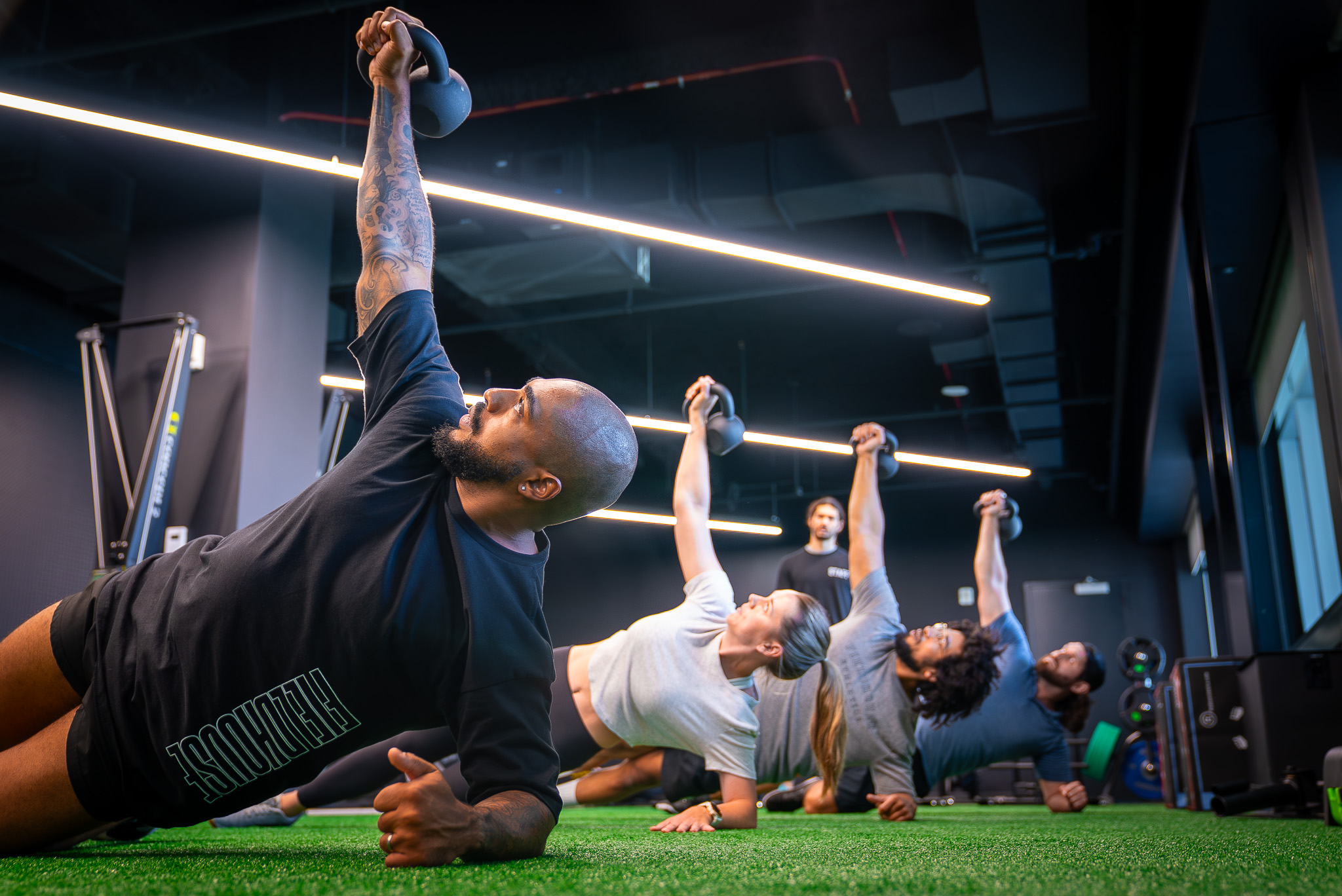 Members participating in a kettlebell class at FIELDHOUSE