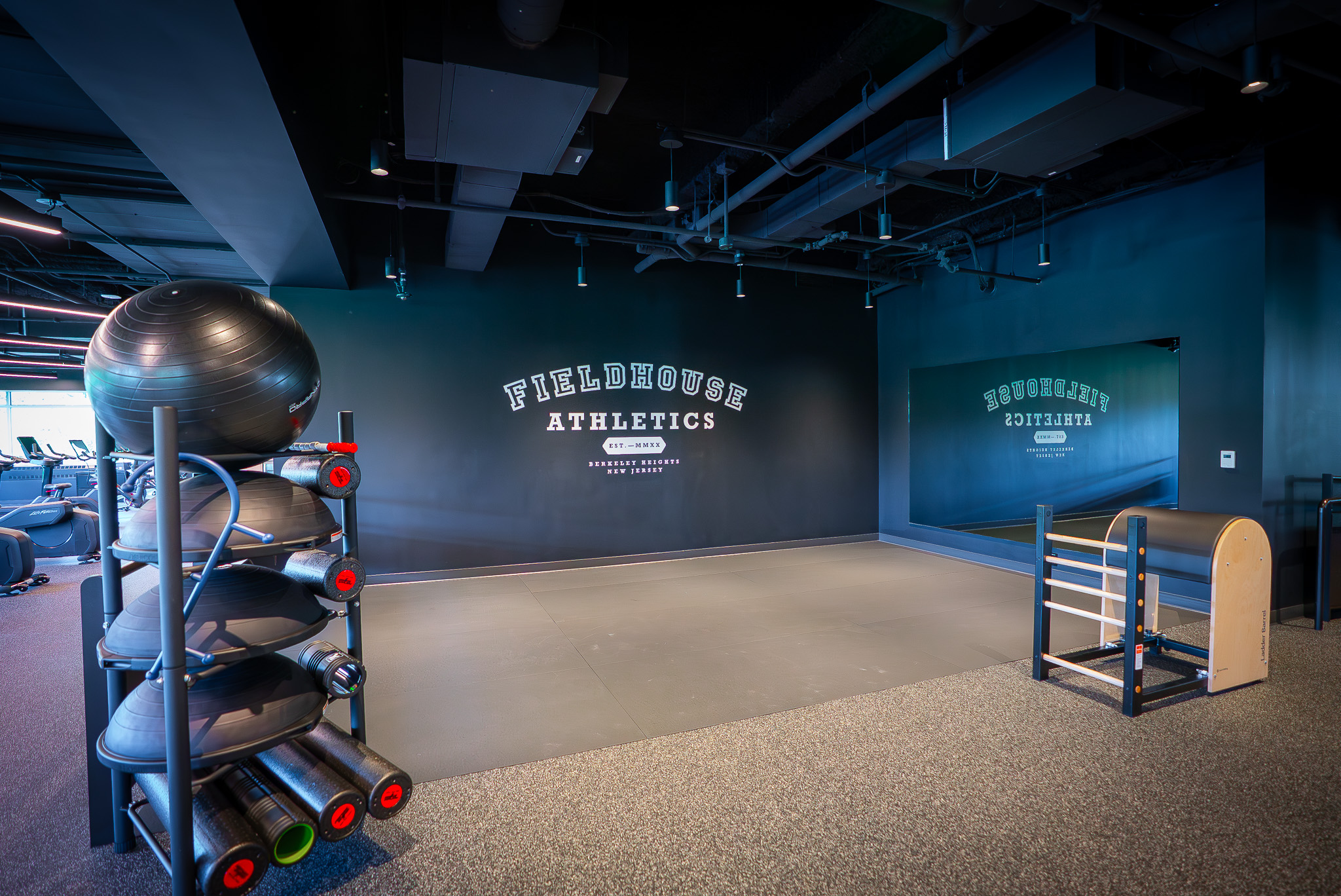 Dedicated stretch and foam rolling area at FIELDHOUSE gym.