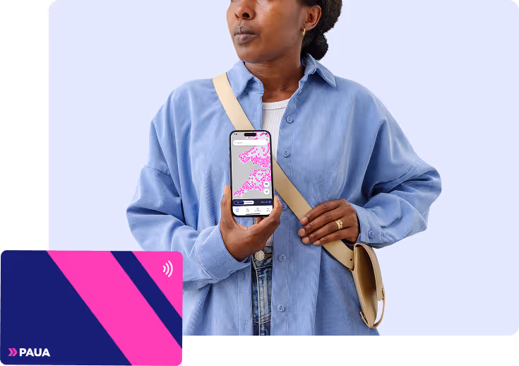 Person holding a smartphone displaying the Paua charging network map, with a Paua RFID card in the foreground.
