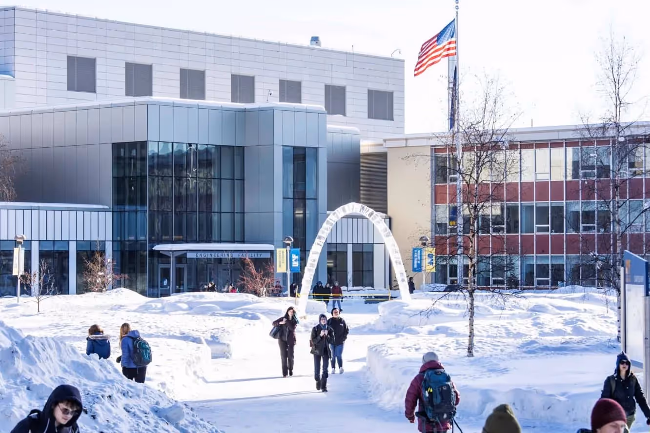 University of Alaska campus in winter - students walking by snowy buildings