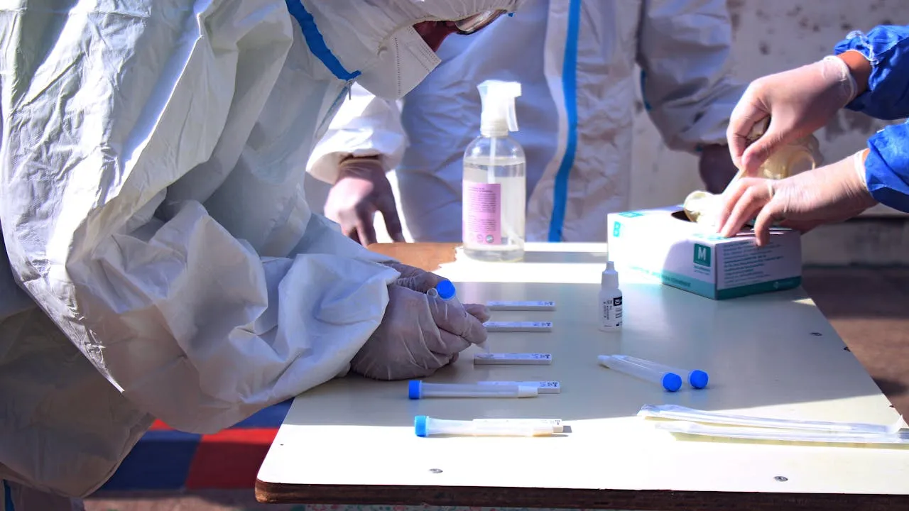 A person practicing phlebotomy technique.