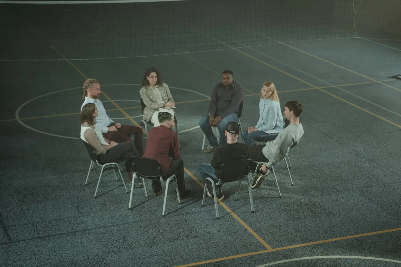 Psychology counseling program: student and professor discussion in classroom.