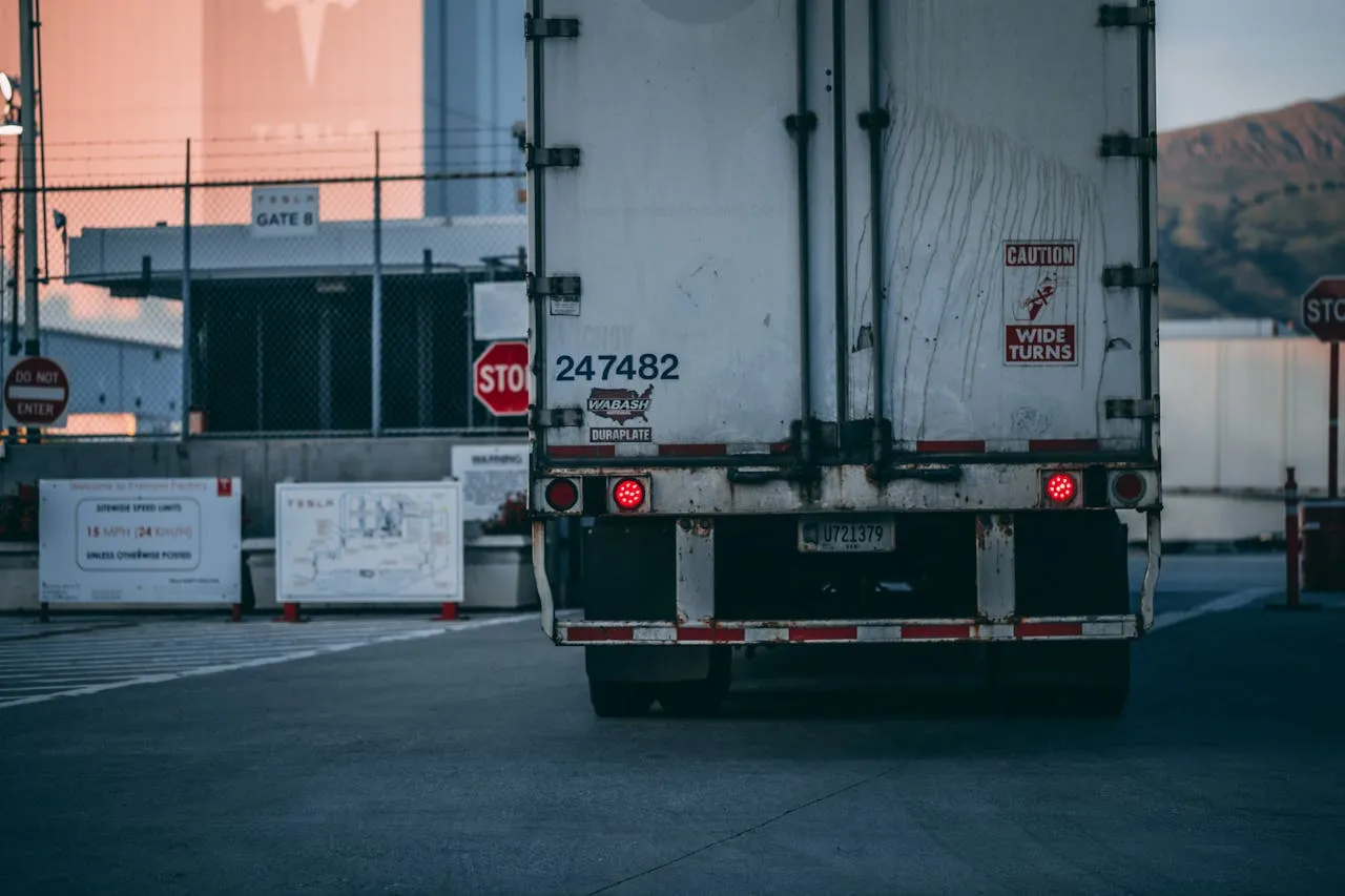 A diverse group of students studying logistics and transportation.