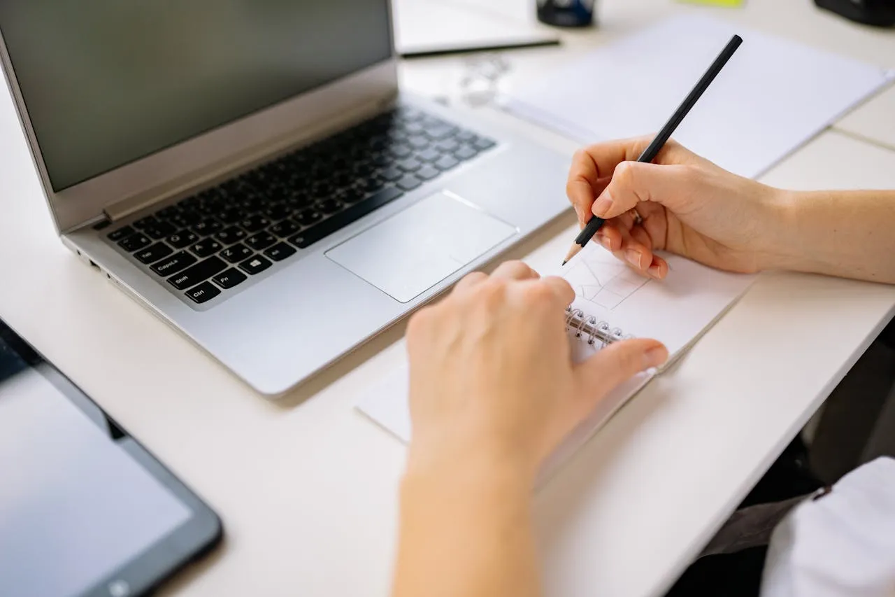 Creative writing student working on laptop