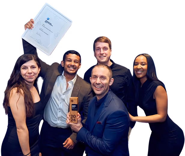 Group of five smiling people holding a framed certificate and a 2024 award trophy.