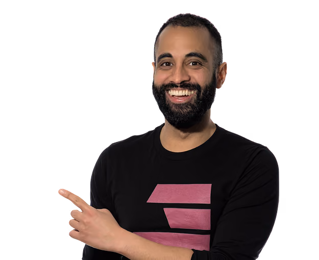 Smiling man with beard in black shirt pointing left against a transparent background.