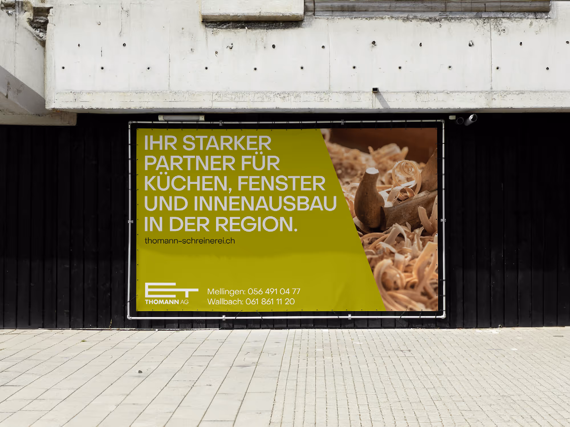 Thomann Carpentry Building Wrap with Plane & Brand Message – Branding by Swiwi Design