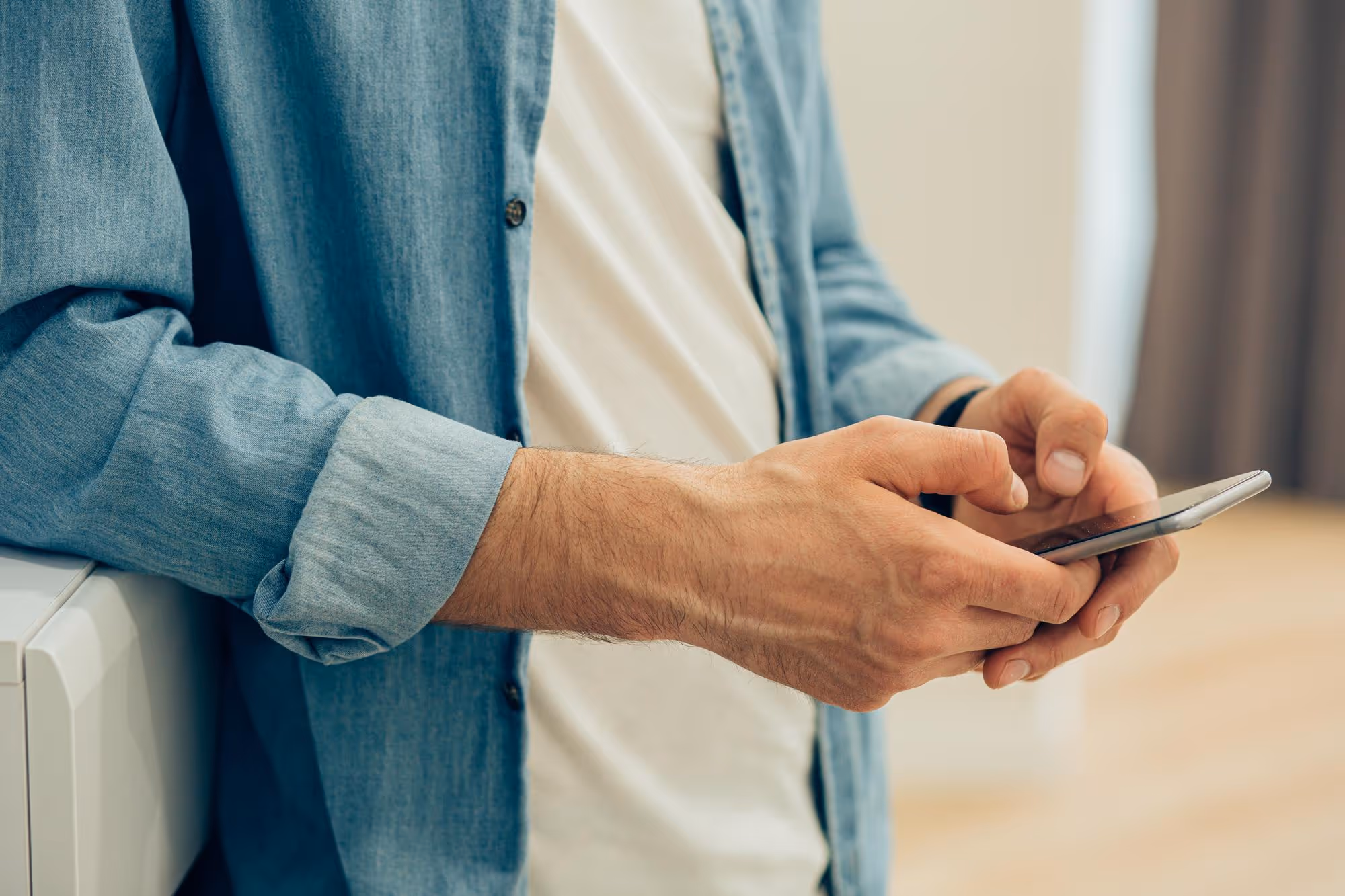 Man texting on Iphone