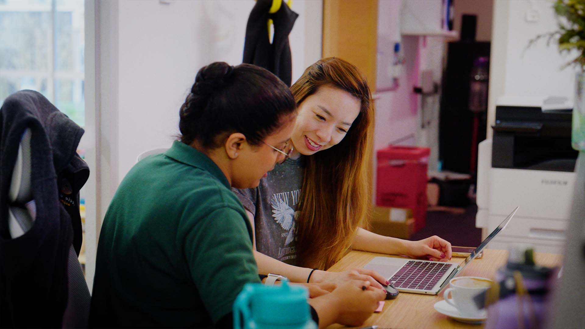 team members working together featured in case study video
