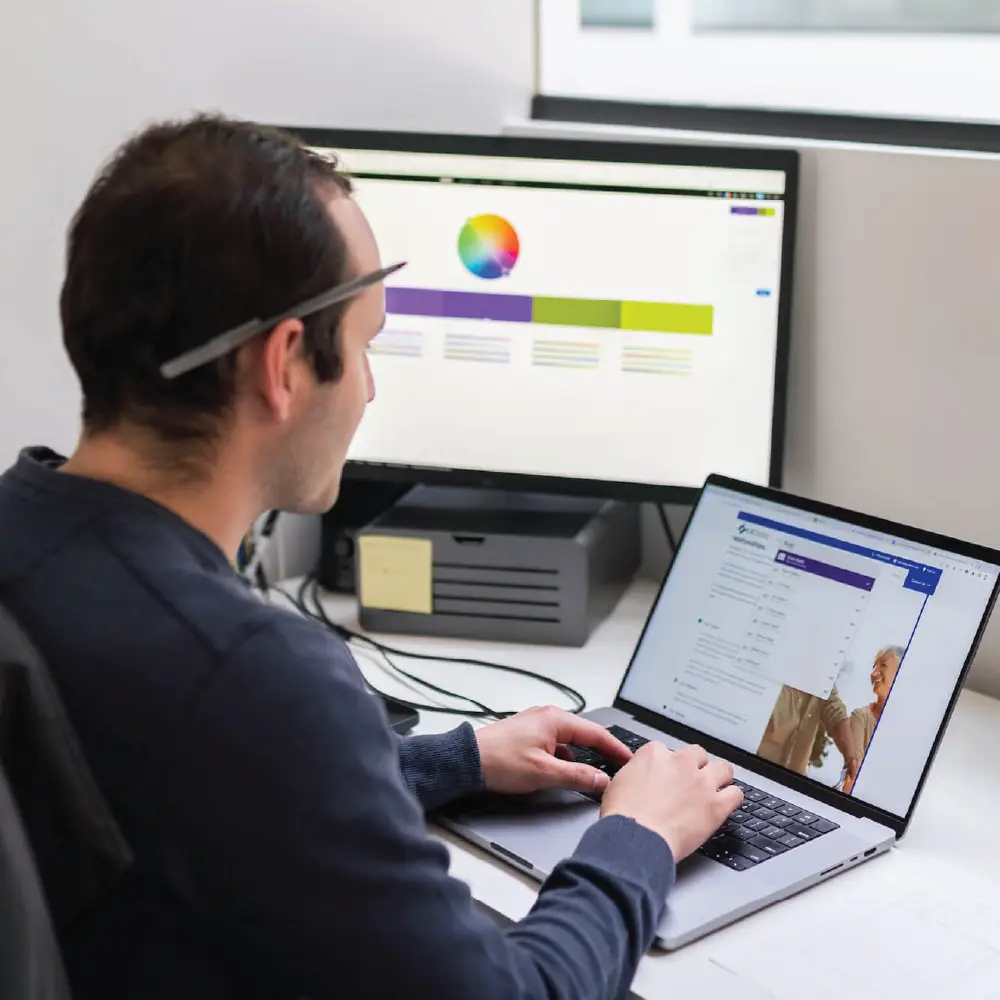 Jacob works at his desk on a website project