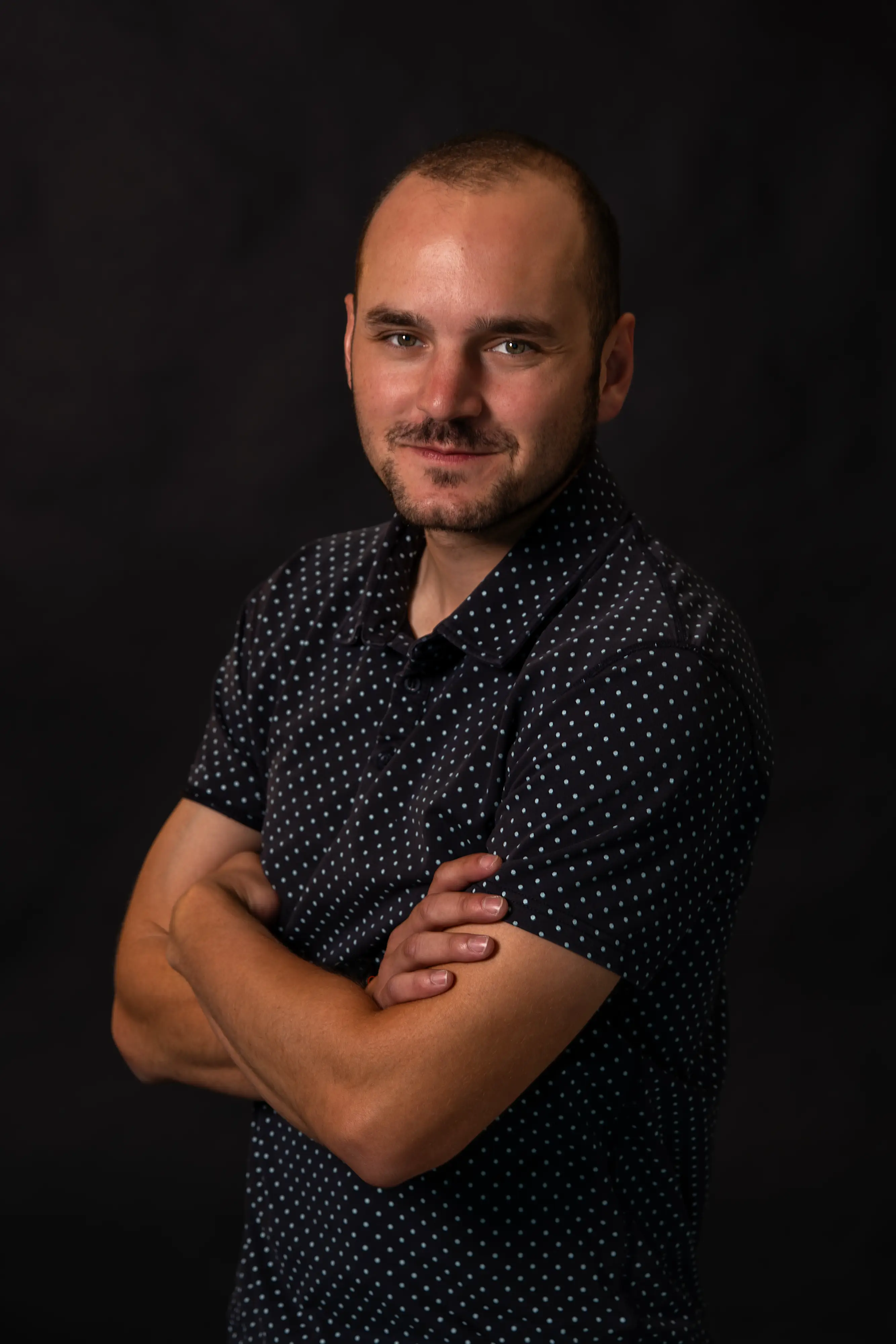 Jacob Trujillo's headshot against a dark backdrop