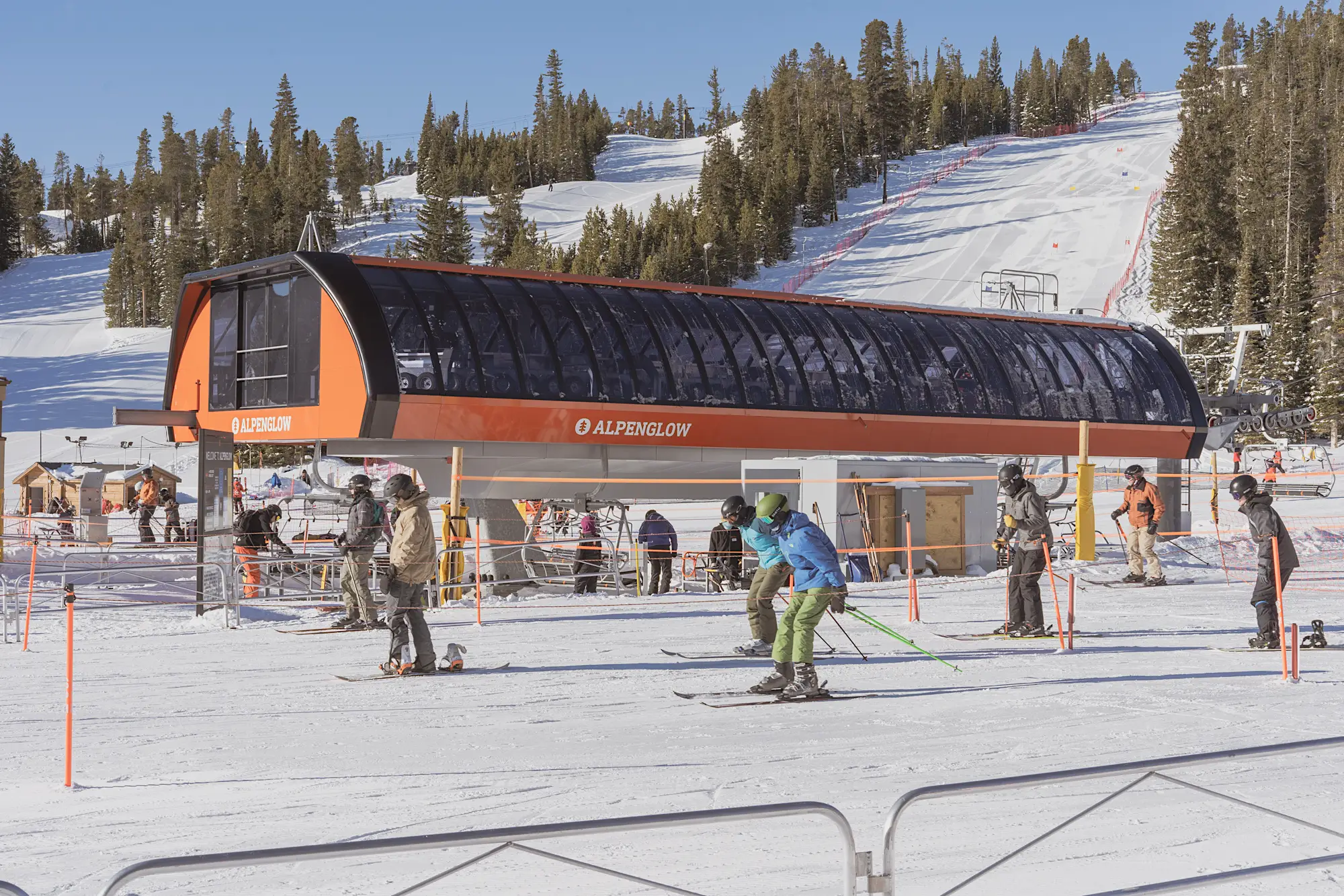 Skiers preparing to board a ski lift at Eldora Ski Resort