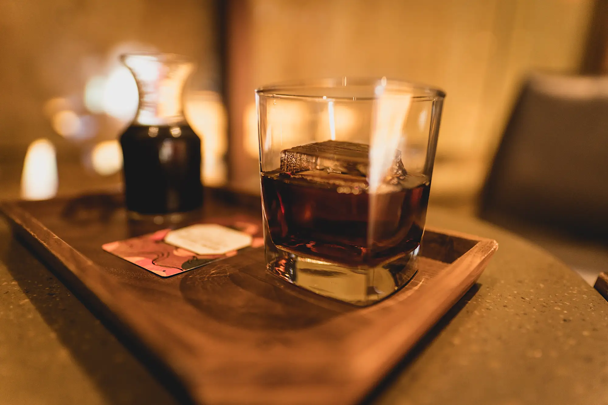 Two coffee glasses filled to the top sitting on a tray