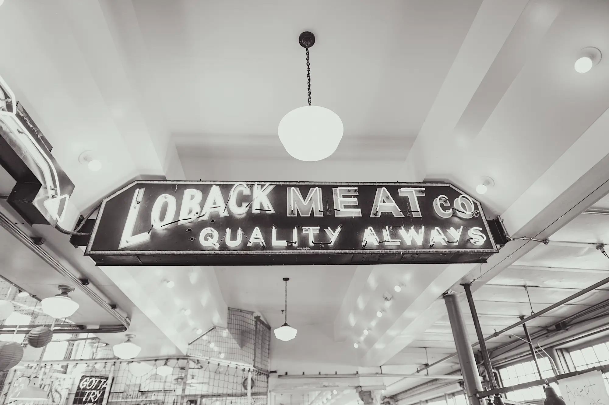 Meat market sign in a crowded street