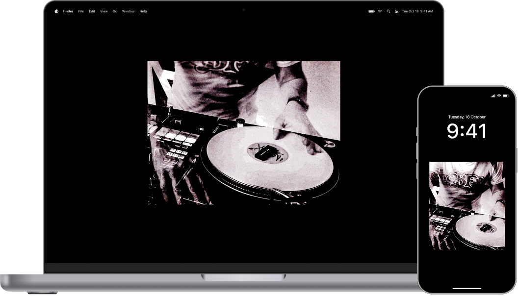 Black & white photo of a DJ behind the turntables. Raw and timeless.