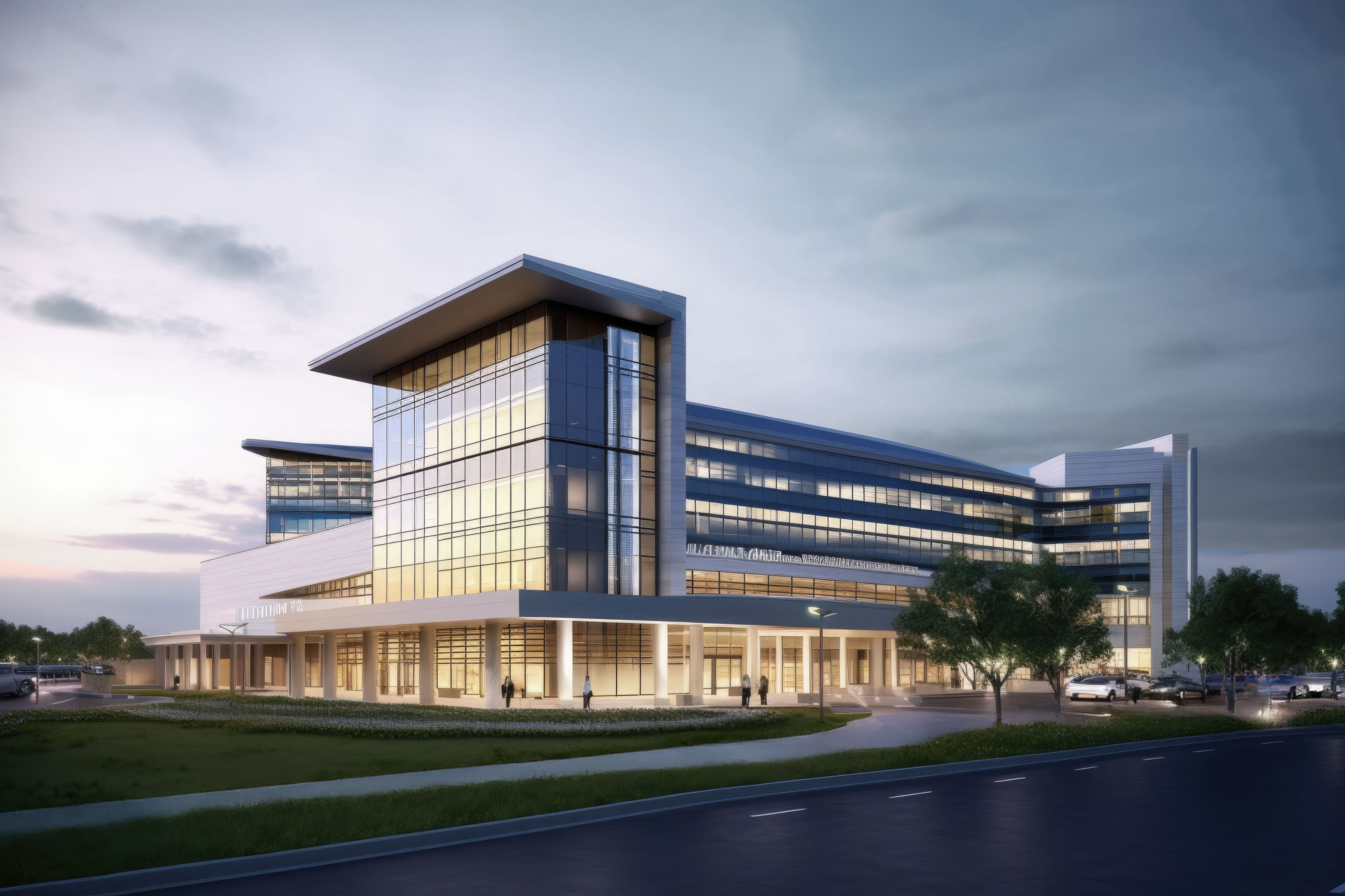 Modern multi-story healthcare building with large glass windows illuminated at dusk with a few pedestrians and cars nearby.