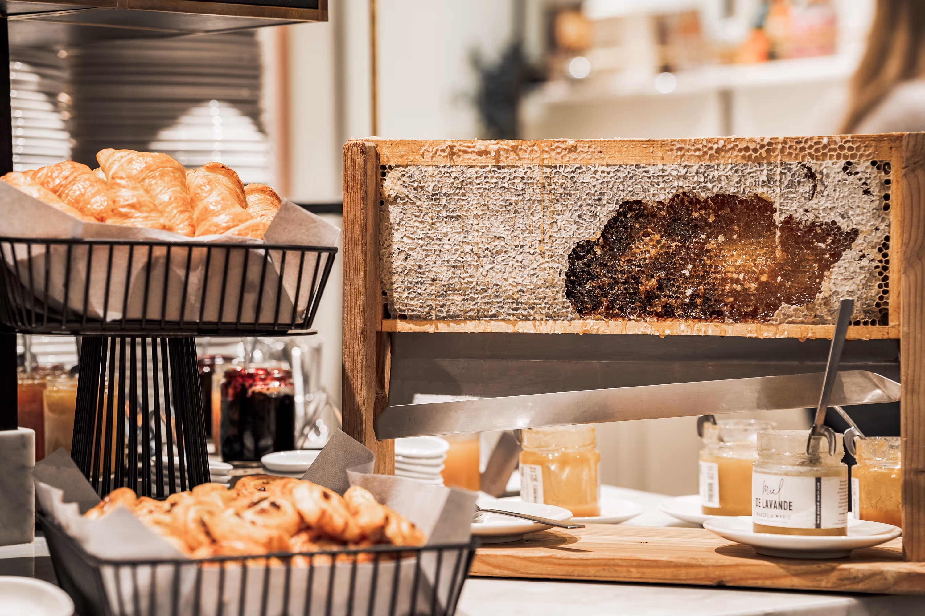 The morning buffet at Hotel Marielle Val Thorens with pastries, honey and much more