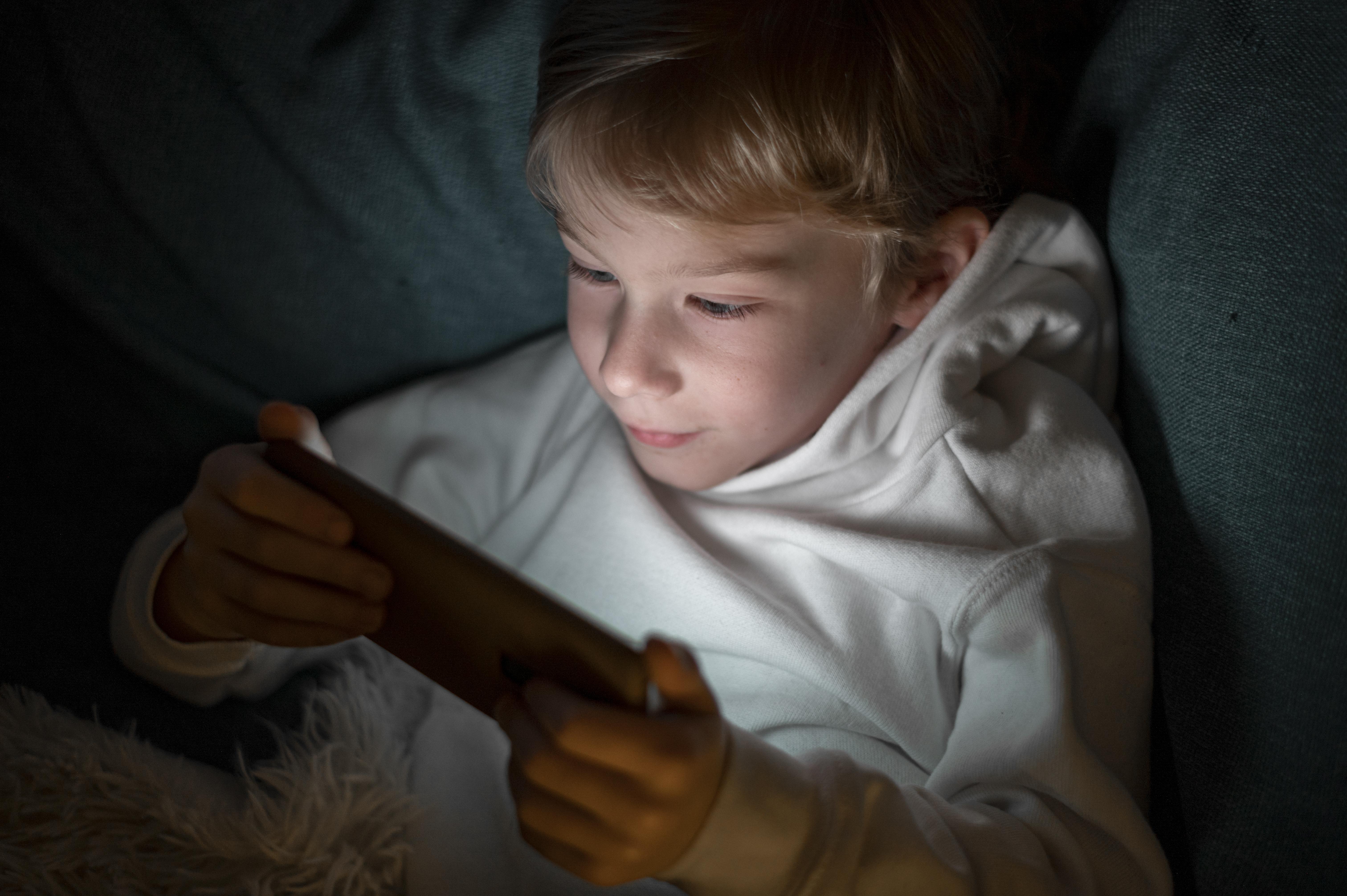 Many children secretly use devices late at night, often hidden under blankets, which disrupts sleep, impacts mood, and harms physical and mental health. This late-night screen use exposes them to addictive behaviors, poor academic performance, and unsupervised content, especially among teenagers who tend to be more independent and secretive. Warning signs include difficulty waking up, daytime irritability, secretive device behavior, and unusual battery drainage by morning. Parents can address this by setting clear no-device-at-night rules, collecting devices before bedtime, and using parental control apps like ParentVerse to enforce curfews, block apps, and monitor usage patterns. These tools help detect late-night scrolling without constant confrontation. Alongside technology, open discussions about the effects of nighttime device use, involving children in setting boundaries, and offering calming bedtime alternatives such as audiobooks or journaling can encourage healthier habits. With consistency, communication, and smart digital tools, parents can protect their child’s sleep and well-being without constant battles.
