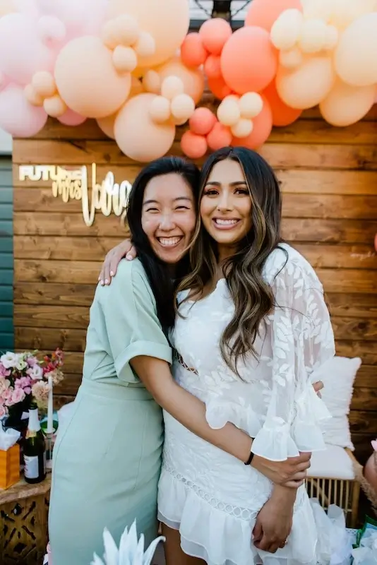 two girls hugging at a bridal shower
