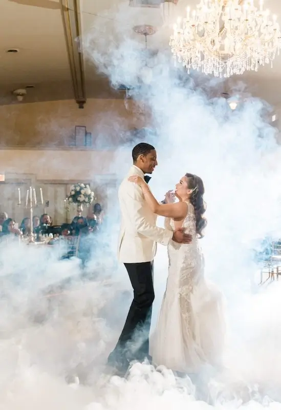 Wedding effect that looks like the bride and groom are engulfed in a cloud while dancing
