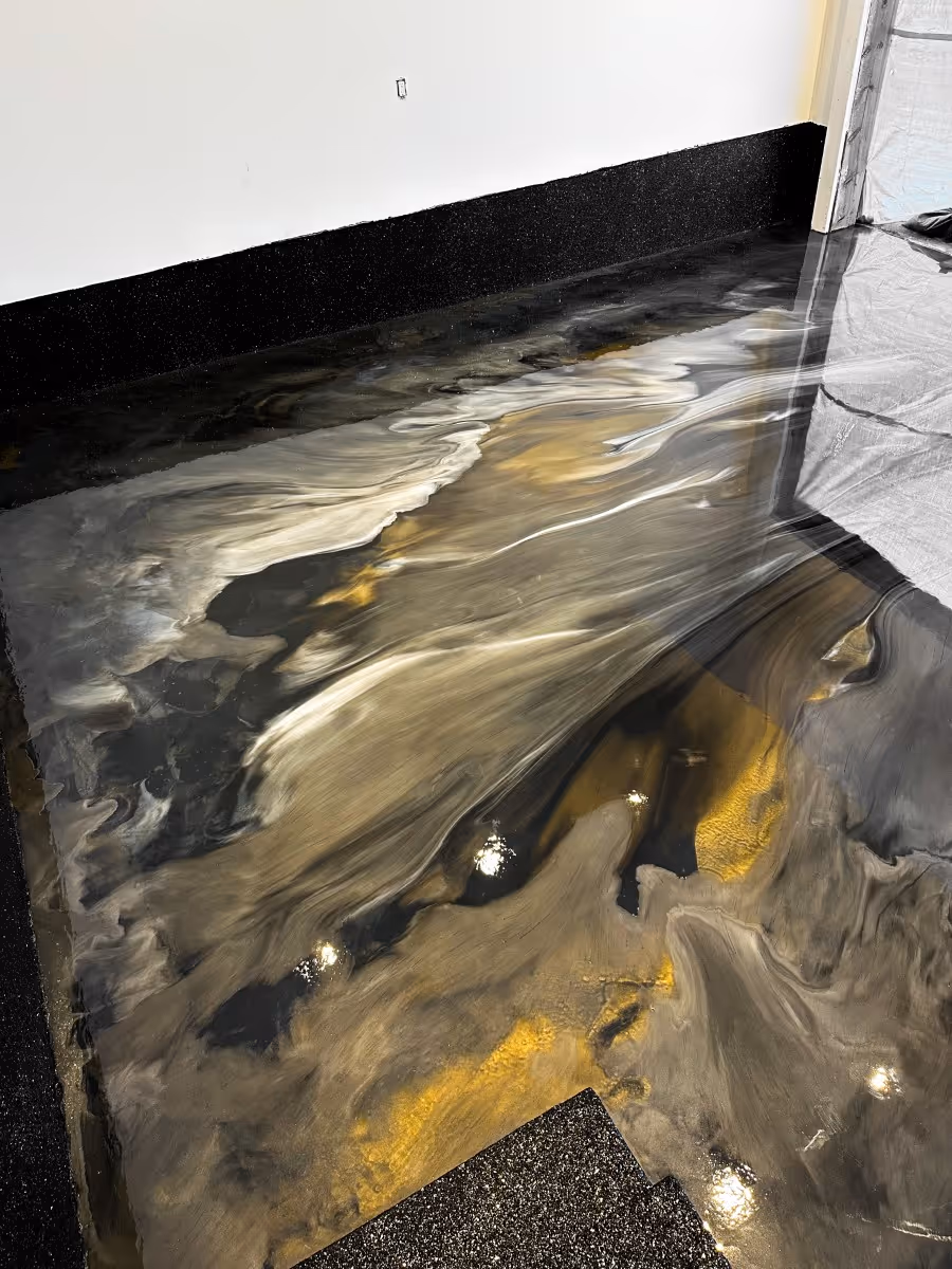 Gold and black metallic epoxy flooring in a Tampa Bay residence 