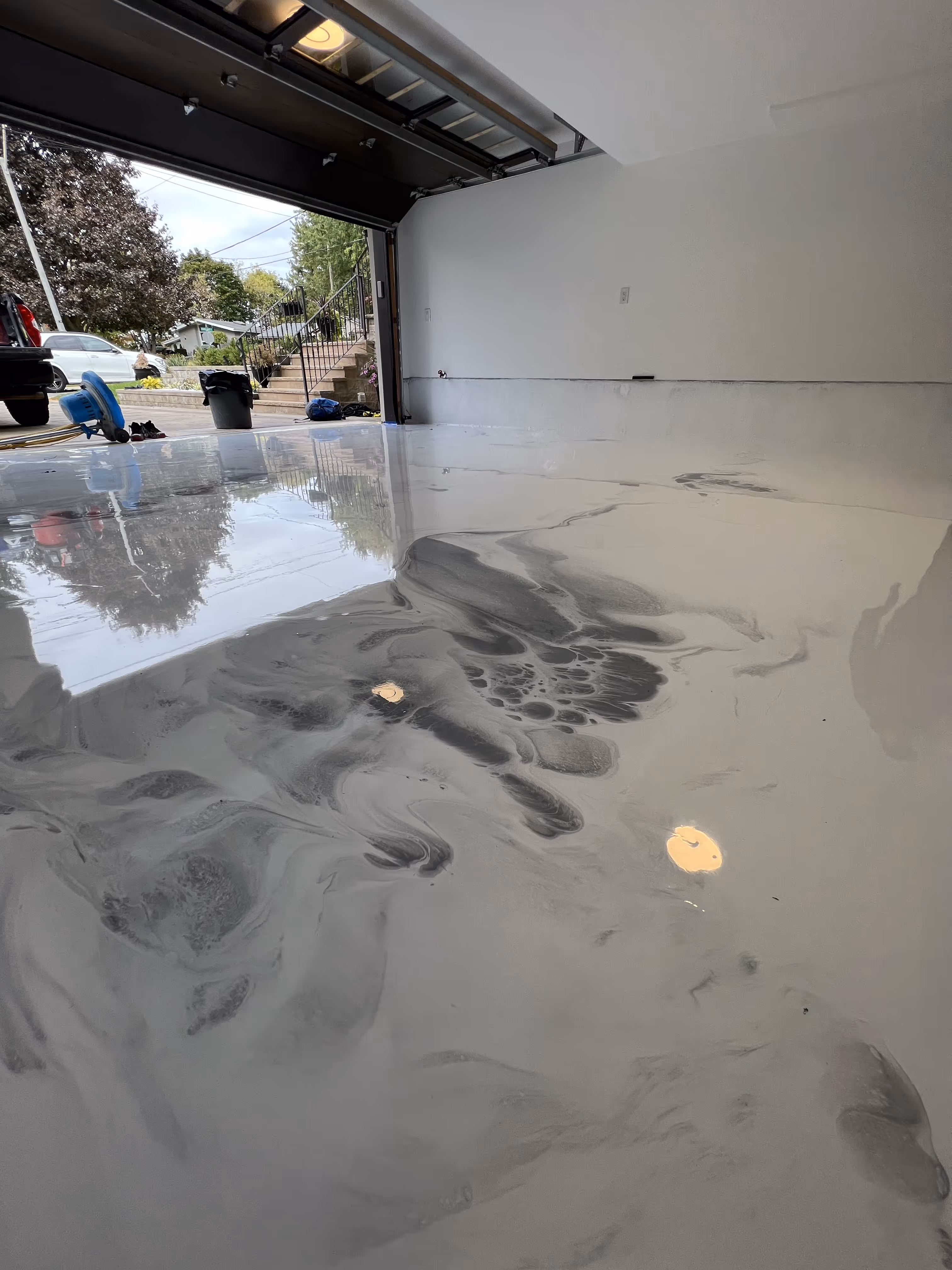 Metallic epoxy floor inside a garage